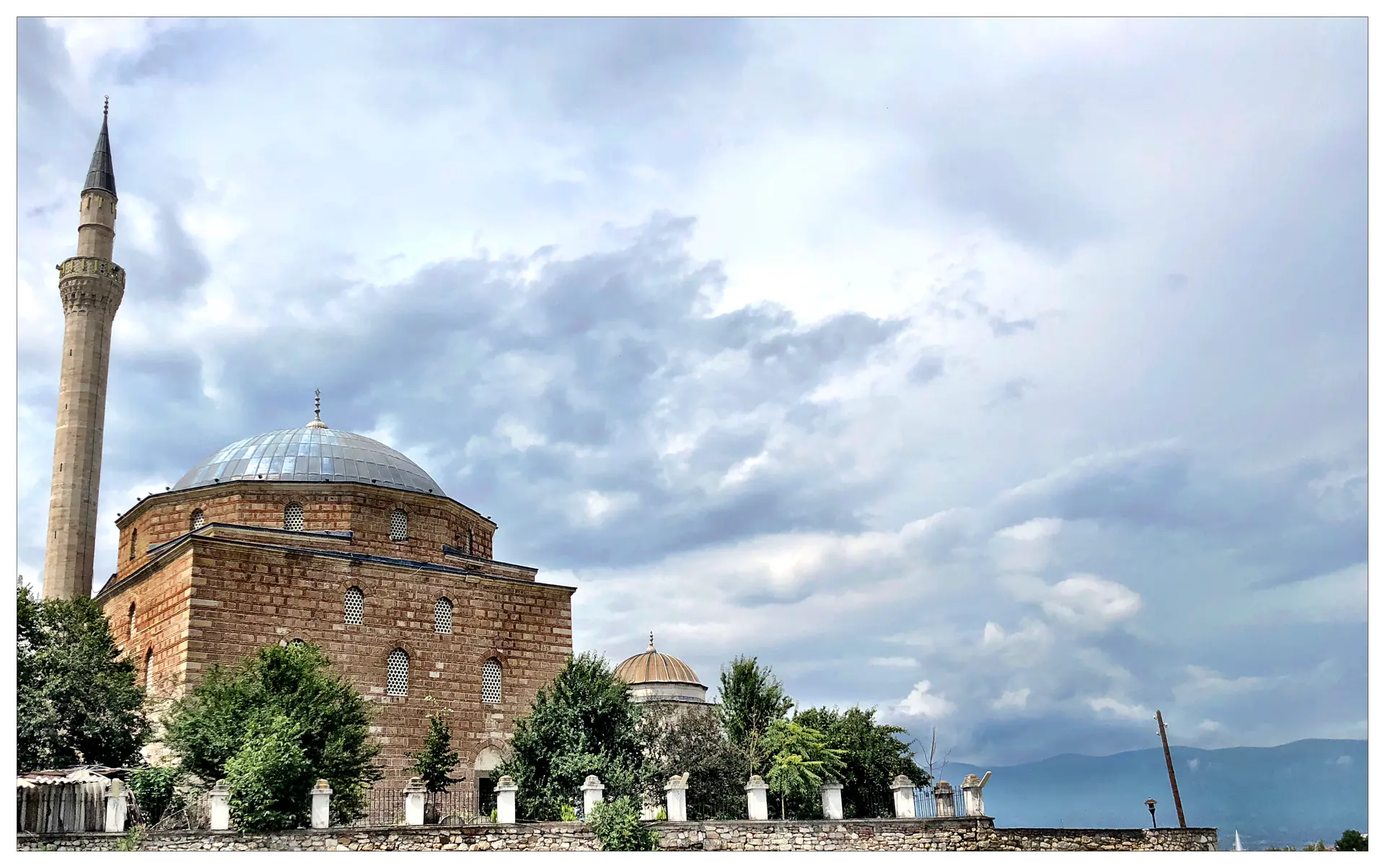 Blue-tiled dome and minaret of Mustafa Pasha Mosque in Skopje