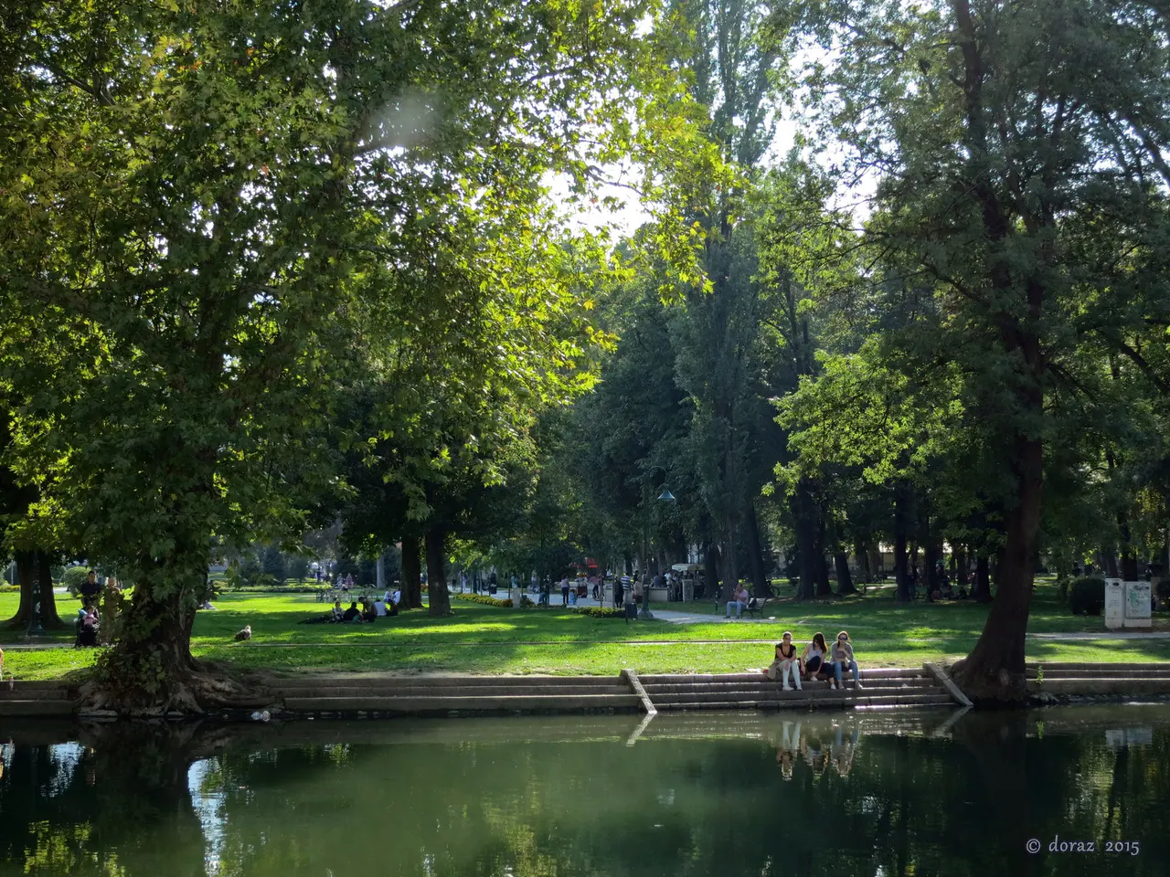 Tree-lined lake and lawns in Skopje City Park